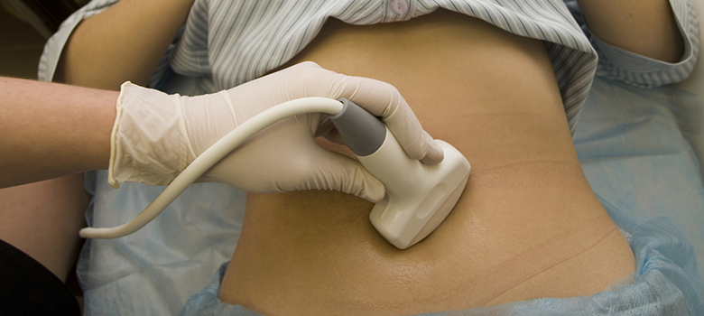 ultrasound wand on abdomen